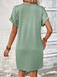 Detailed back view of a sage green short sleeve t-shirt dress featuring rolled cuffs.