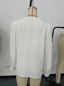 Back view of white Swiss dot long sleeve blouse with elegant ruffled cuffs for women