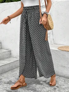 Detailed view showing side slit and geometric print on these summer wide-leg pants