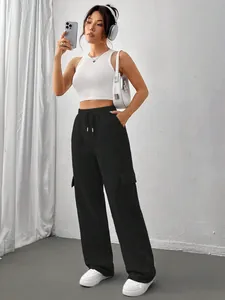 Close-up of black wide-leg cargo sweatpants with drawstring waist and side pockets