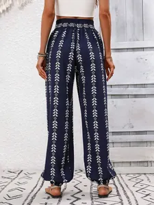 Detailed back view of bohemian navy blue harem pants with white geometric tribal print