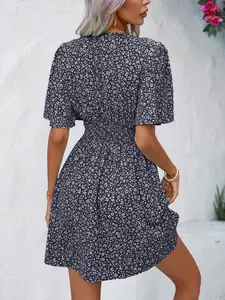 Back view detail of high-waisted floral print pleated summer dress for women