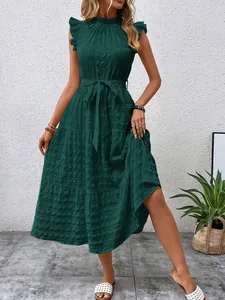 Detailed view of dark green textured dress with fly sleeves and a tie-waist belt