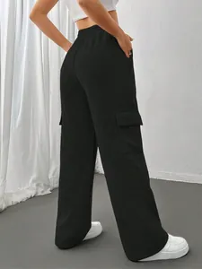 Back view of black cargo wide-leg sweatpants showing the functional side pocket