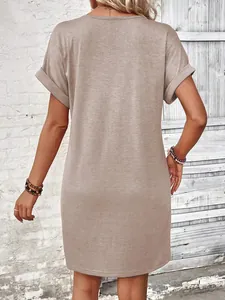Detailed back view of a stylish khaki solid color t-shirt dress with rolled cuffs.