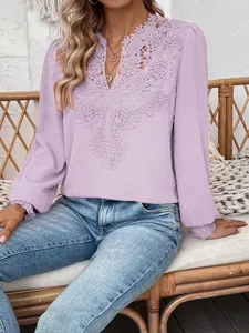 Lavender V-neck long sleeve top with intricate lace embroidery and Swiss dot fabric detail.