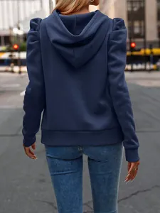 Detailed back view of navy blue hooded sweatshirt featuring trendy puff sleeves.