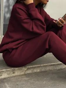 Women's oversized maroon two-piece tracksuit set with premium thick fleece fabric