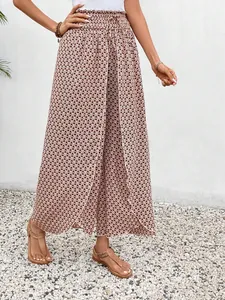 Detailed shot of bohemian geometric patterned wide-leg culottes with stylish side slits