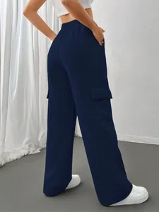 Back view of stylish navy blue cargo sweatpants with side pockets and wide-leg fit