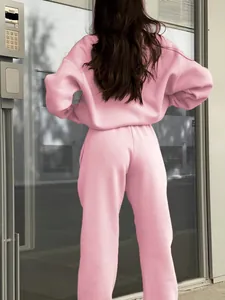 Back view of a casual pink two-piece tracksuit set with oversized sweatshirt and pants