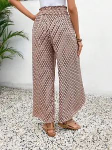 Close-up detail of geometric print and side slit on breezy summer wide-leg pants