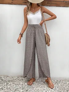 Detailed view of summer high-waist geometric print wide-leg pants with side slits.