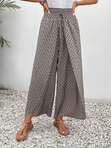 Elegant high-waisted wide-leg culottes with geometric print and side slits for summer.