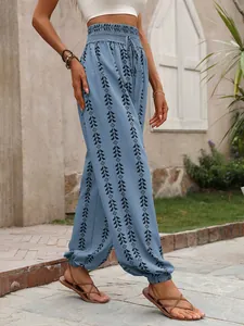 Detailed view of boho style blue lantern pants featuring a tribal geometric print pattern