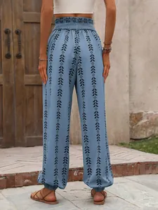 Back view of women's blue lantern pants featuring ethnic geometric print details