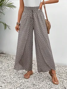 High-waisted geometric print wide-leg trousers with side slits and drawstring waist