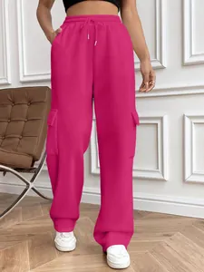 Hot pink wide leg cargo sweatpants with drawstring waist for women, street style look.