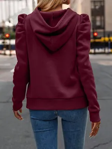 Detailed back view of a burgundy long sleeve hoodie featuring fashionable puff shoulders