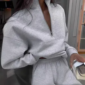 Chic grey two-piece lounge set with a quarter-zip sweatshirt and matching sweatpants