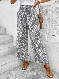 Bohemian style women's high-waisted floral wide-leg pants featuring a chic side slit design