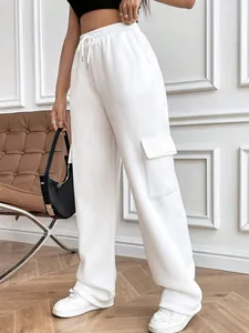 Detail view of women's white high-waisted cargo sweatpants with side flap pocket