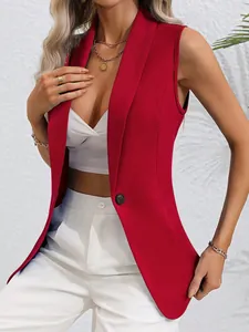 Close-up of elegant red sleeveless blazer with single black button closure.