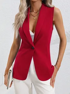 Close-up detail of a bright red sleeveless blazer jacket featuring a single button and shawl collar.
