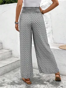 Back view of high-waisted wide-leg pants with stylish black and white geometric print
