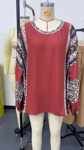 Detail of women's casual round neck sweatshirt with leopard print and ethnic pattern