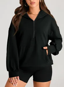 Detailed front view of a women's black quarter-zip hoodie with kangaroo pocket