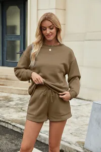 Casual brown two-piece set featuring a crewneck sweatshirt and matching drawstring shorts.