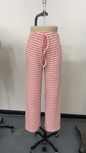 Detailed macro view showing the pink and white horizontal striped fabric of these lounge pants