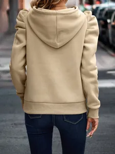 Detailed back view of a beige women's hooded sweatshirt with stylish puff sleeves and ribbed hem.