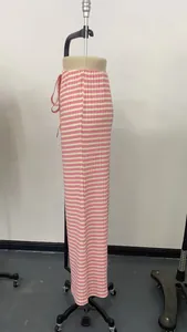 Close-up detail of pink and white striped straight-leg pants featuring a drawstring waist