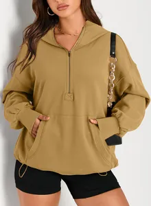 Detailed view of a mustard yellow women's oversized hooded sweatshirt with a half-zip front