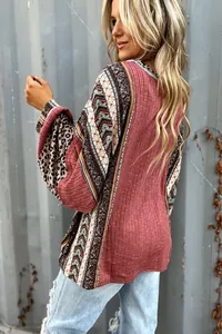 Detail view of bohemian colorblock sweatshirt with leopard and geometric prints.