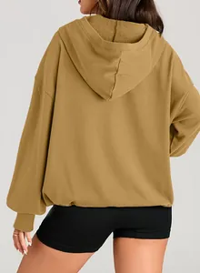 Back view of women's solid brown oversized zip-up hoodie showing fleece lining.