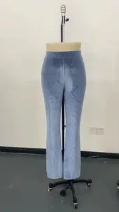 Detailed view of light blue high-waisted corduroy flare pants showing the ribbed texture