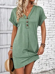 Elegant casual sage green V-neck mini dress featuring decorative buttons and rolled sleeves