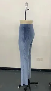 High-waisted light blue corduroy flare pants shown from the side on a mannequin.