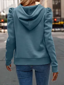 Rear view of a blue women's hooded sweatshirt featuring elegant puff sleeves and casual style