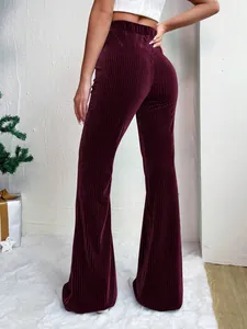 High-waisted burgundy corduroy flared pants for women back view.