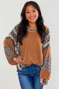 Detail showing the leopard print and tribal patchwork on this women's ribbed sweatshirt