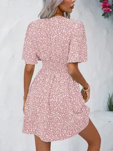 Back view of pink floral dress with high elastic waist and delicate white print pattern
