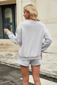 Detailed back view of a light grey two-piece sweatshirt and pocketed shorts lounge set