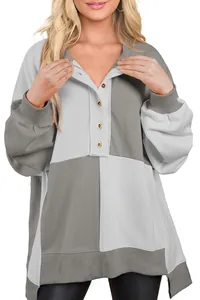 Detail showing the color-block paneled design and buttoned collar of this casual sweatshirt