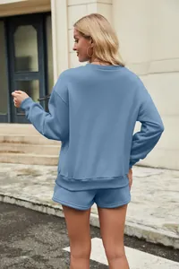 Detailed back view of a women's stylish dusty blue two-piece sweatshirt and shorts lounge set.
