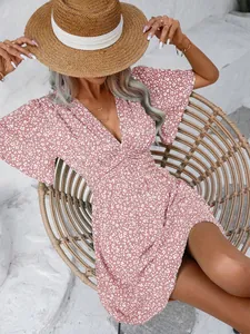 Pink floral V-neck summer dress with mid-length flare sleeves and a high waist design