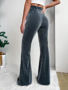 Back view of high-waisted grey corduroy flare pants showing ribbed texture and fit